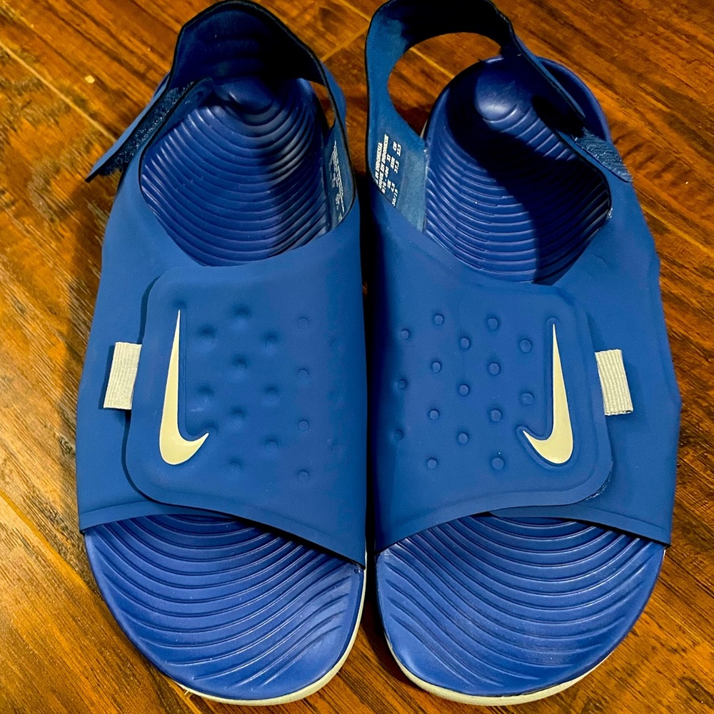 Blue and white Nike sandals